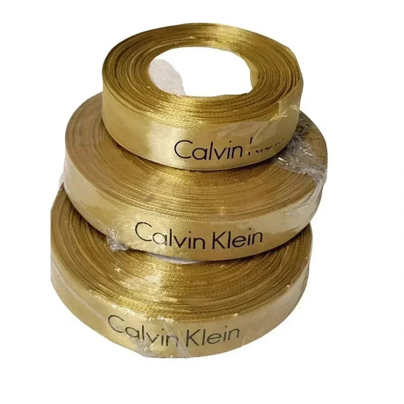 Calvin Klei Gift Wrap Ribbon Golden NEW Aprox 75 yards